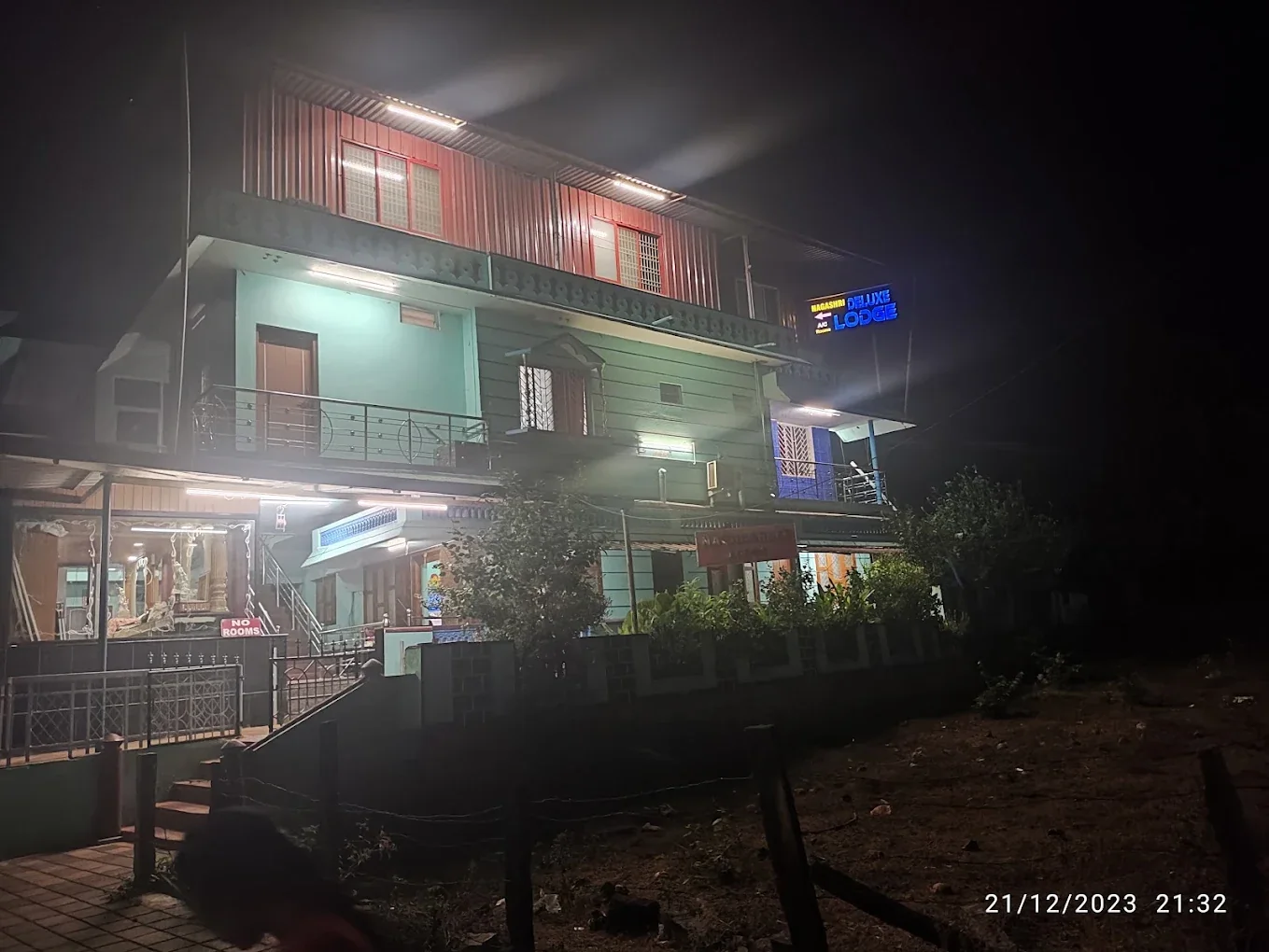 Nagashree Lodge room with bed, seating and television